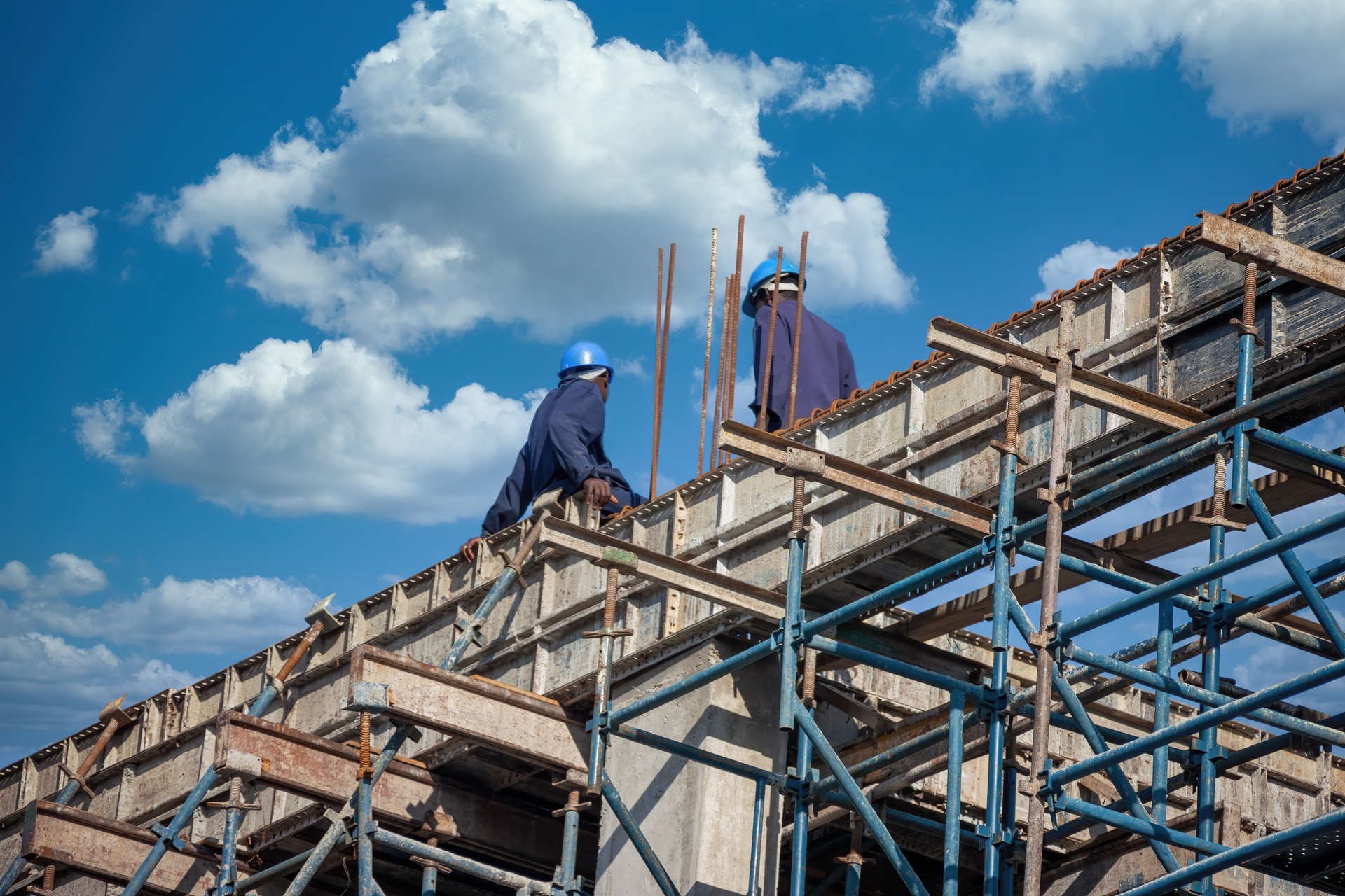 african construction workers climbed on the scaffolding
